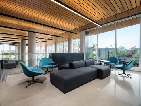 Seating area by floor-to-ceiling windows